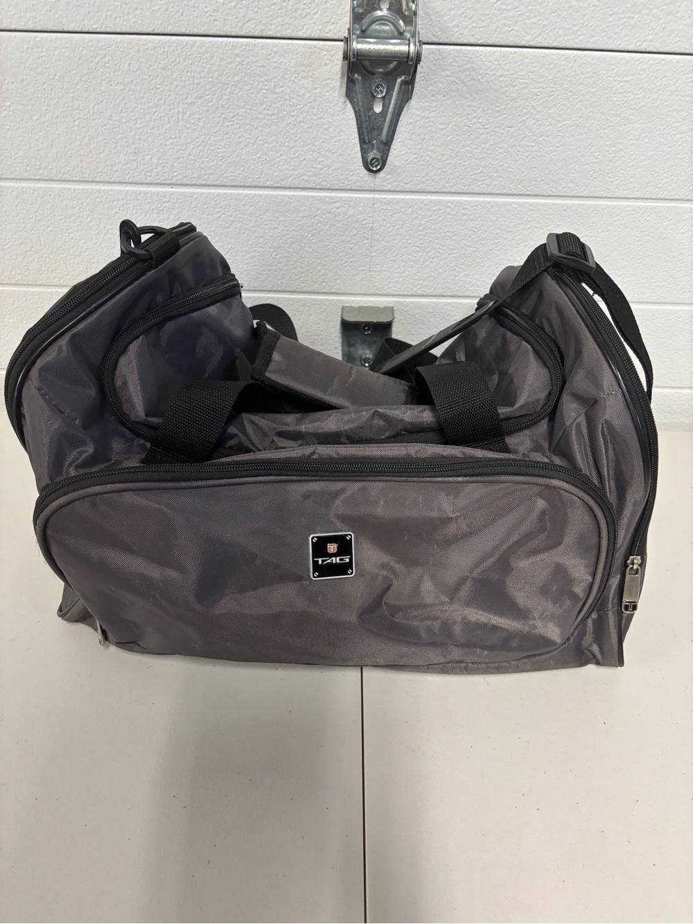 Tag Gray Travel Duffel with Multiple Zip Pockets and Adjustable Shoulder Strap